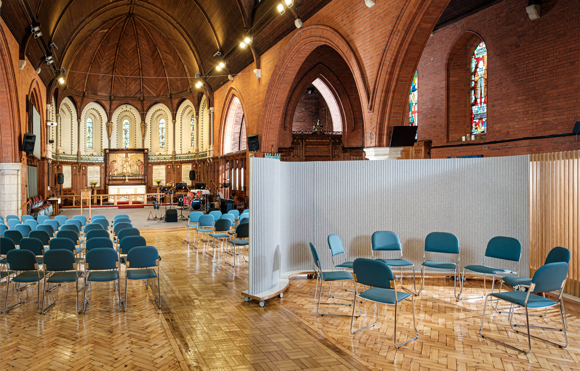 ThinkingWall partitioning creates a small meeting area in a large nave